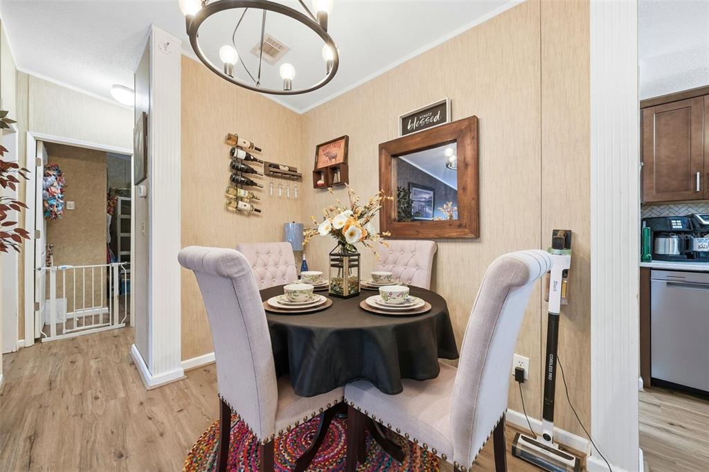 104 Ferncreek Drive Georgetown, FL 32139 - Photo 10 of 52 a view of a dining room with furniture and wooden floor