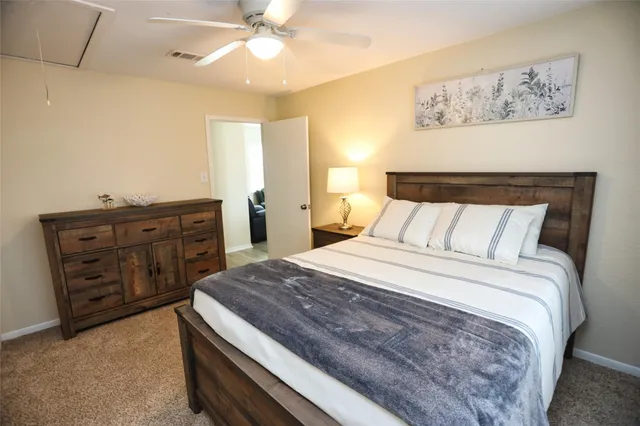 a bathroom with a toilet sink and shower