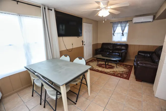 a kitchen with stainless steel appliances a stove a sink and a refrigerator