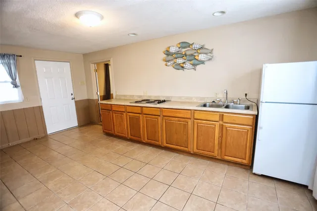 a kitchen with a cabinets and window