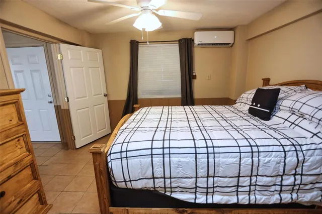 a bathroom with a toilet a sink and a mirror