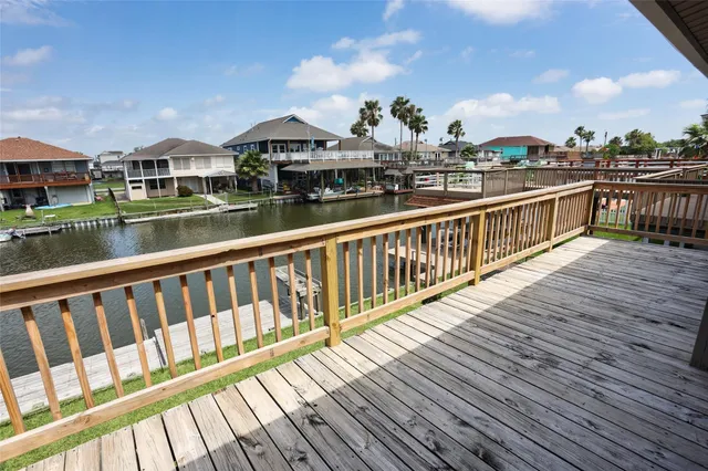a view of a house with wooden deck