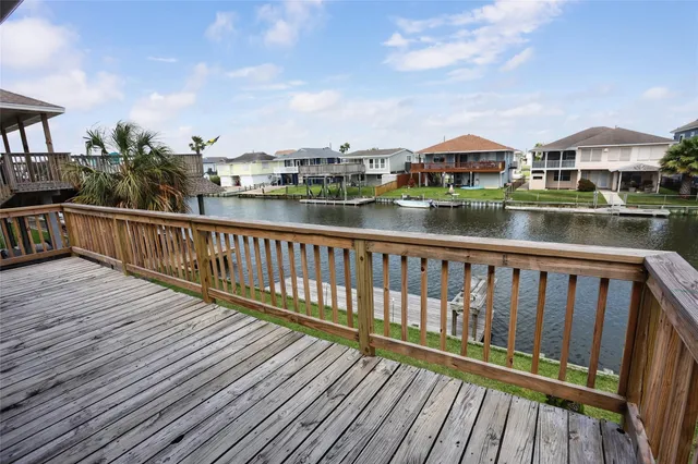 a view of a lake with a table and chairs