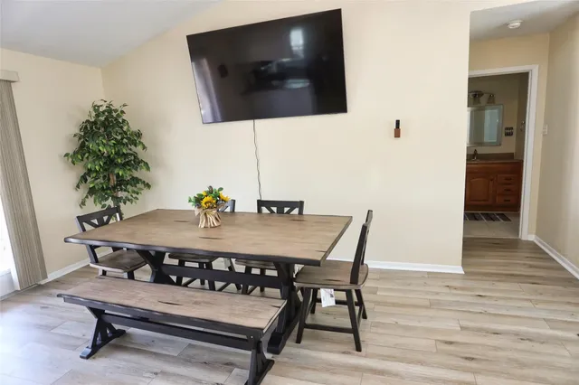 a bedroom with a bed and a potted plant
