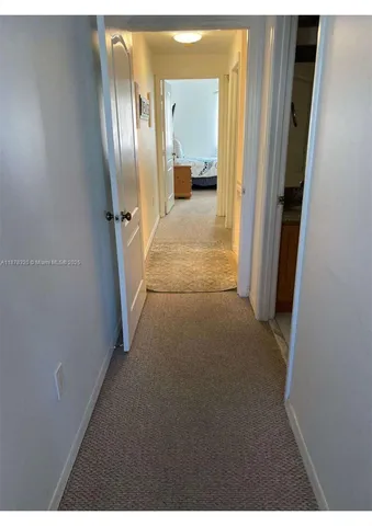 a balcony view with couple of chairs and wooden floor