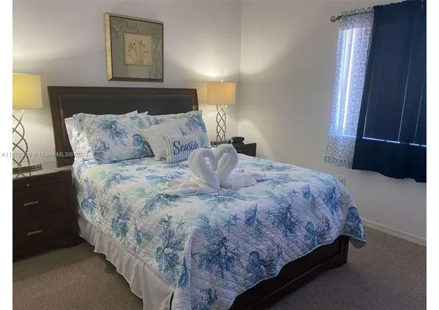 a bathroom with a sink toilet and mirror