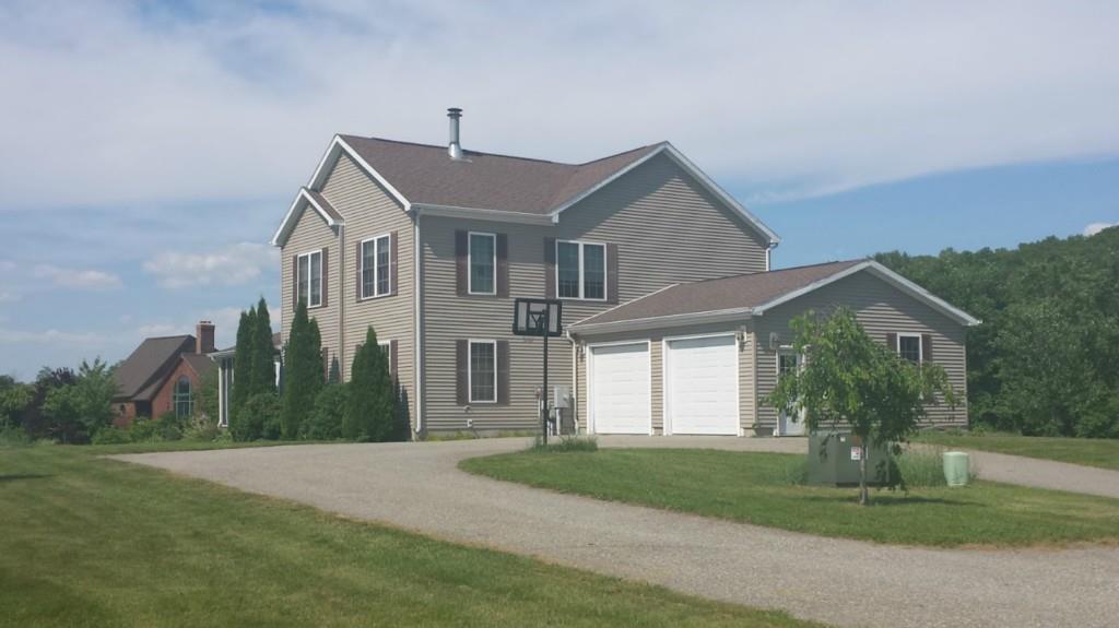 a front view of a house with a yard