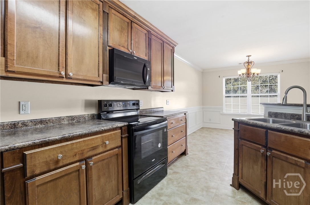 130 Terraza Lane Savannah, GA 31405 - Photo 11 of 31 Standing in Kitchen Looking Into Dining Room