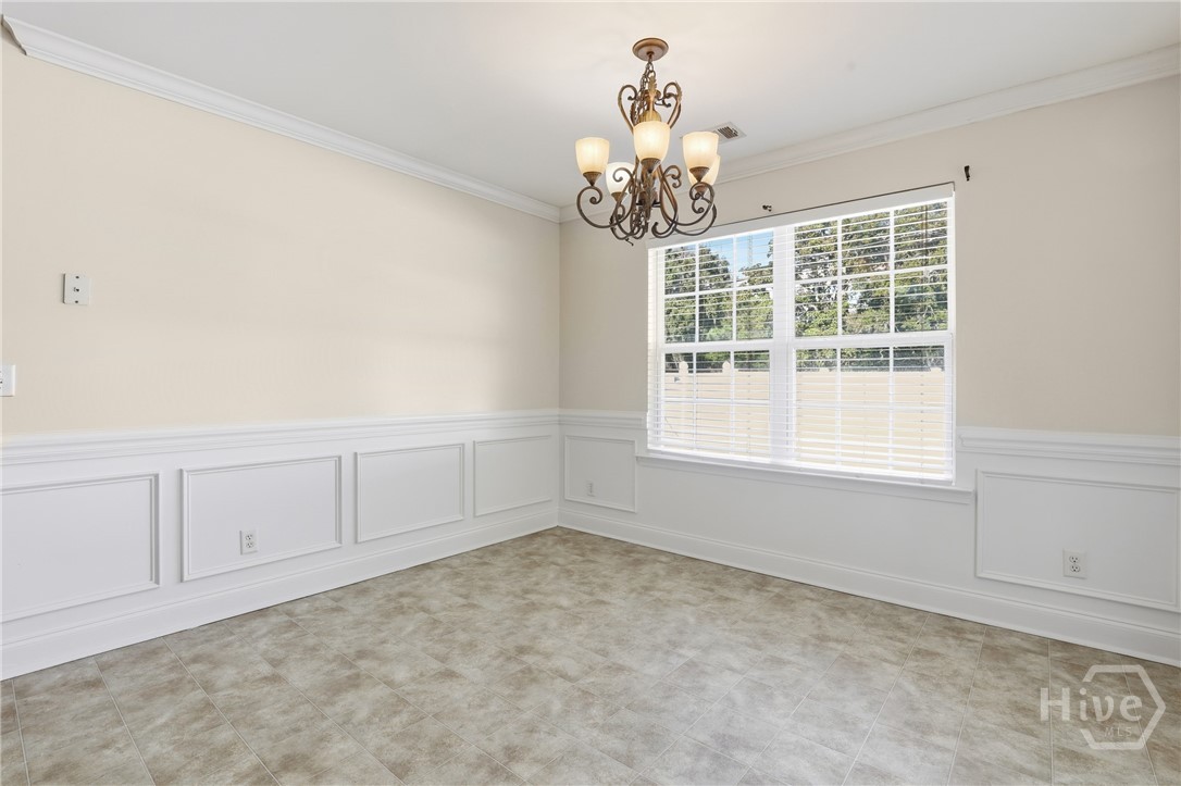 130 Terraza Lane Savannah, GA 31405 - Photo 13 of 31 Double Windows Let Natural Light Stream In! Crown Molding, Chair Rail and Wainscotting Make the Dining Room Pop!