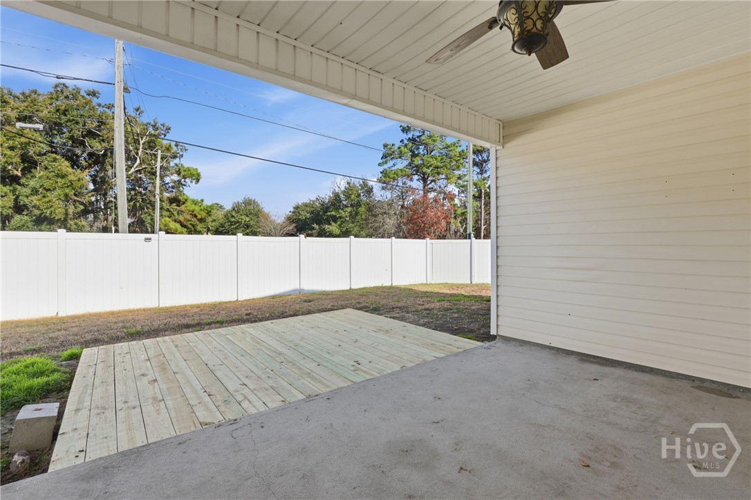 130 Terraza Lane Savannah, GA 31405 - Photo 26 of 31 Covered Patio With Ceiling Fan. Brand New Wood Deck