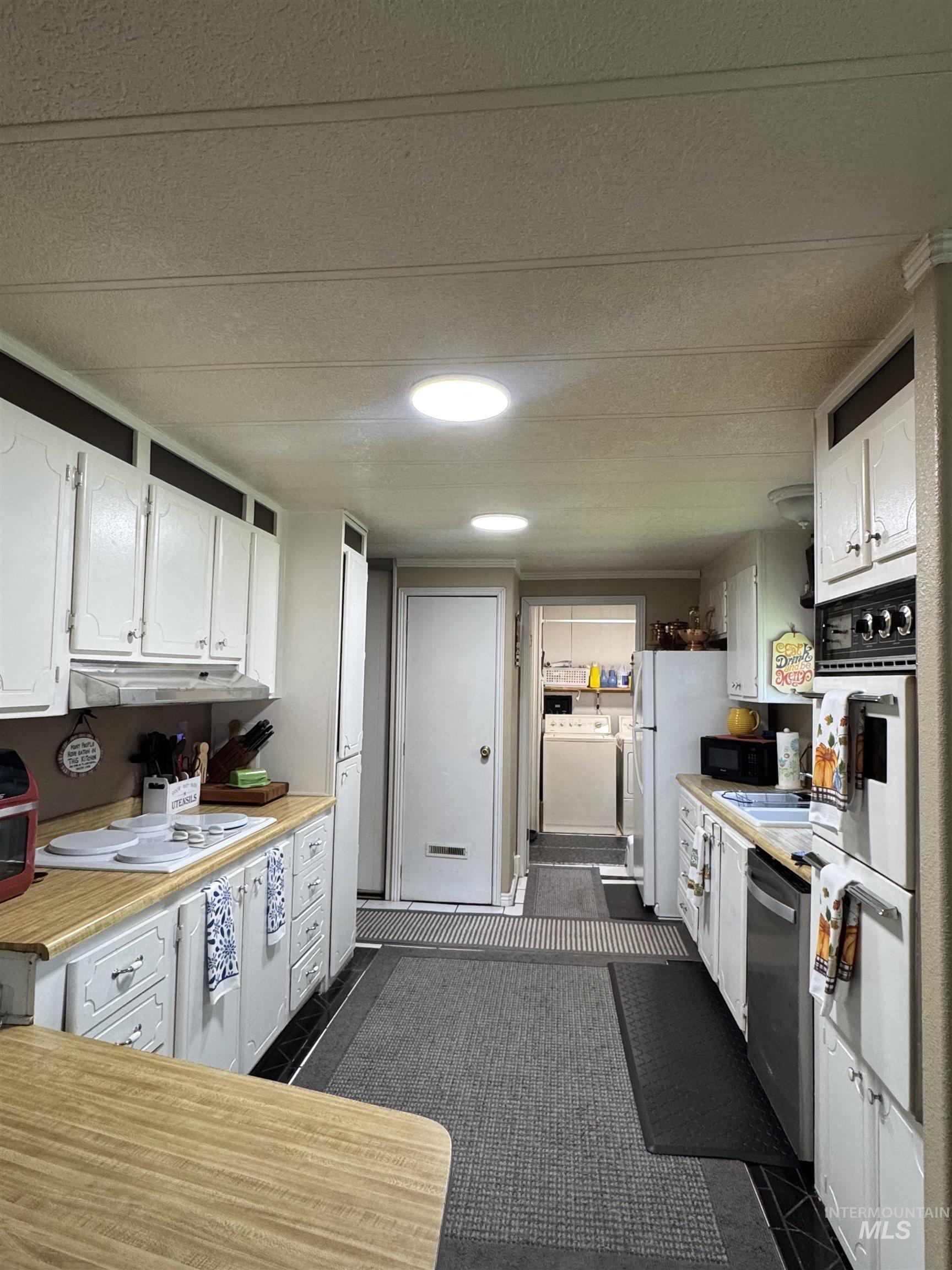 1200 Artesian Road, Unit 36 Eagle, ID 83616 - Photo 5 of 13 White cabinetry with decorative hardware
