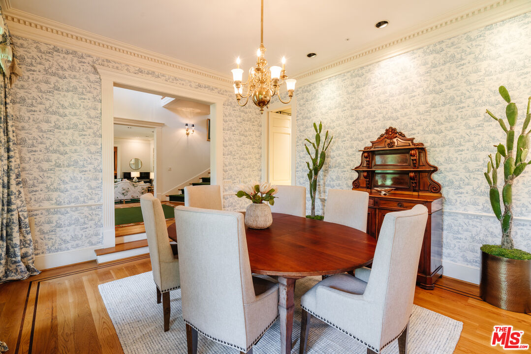 4261 Ledge Avenue Toluca Lake, CA 91602 - Photo 15 of 49 a view of a dining room with furniture and wooden floor