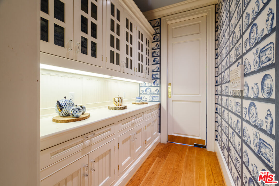 4261 Ledge Avenue Toluca Lake, CA 91602 - Photo 23 of 49 a bathroom with a sink and a mirror