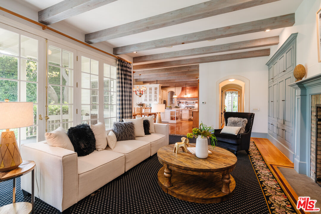 4261 Ledge Avenue Toluca Lake, CA 91602 - Photo 24 of 49 a living room with furniture and a large window