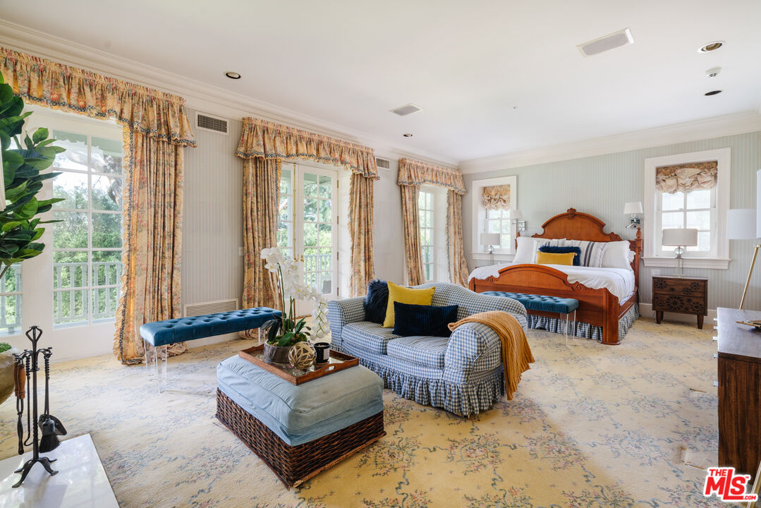 4261 Ledge Avenue Toluca Lake, CA 91602 - Photo 29 of 49 a living room with furniture and a large window