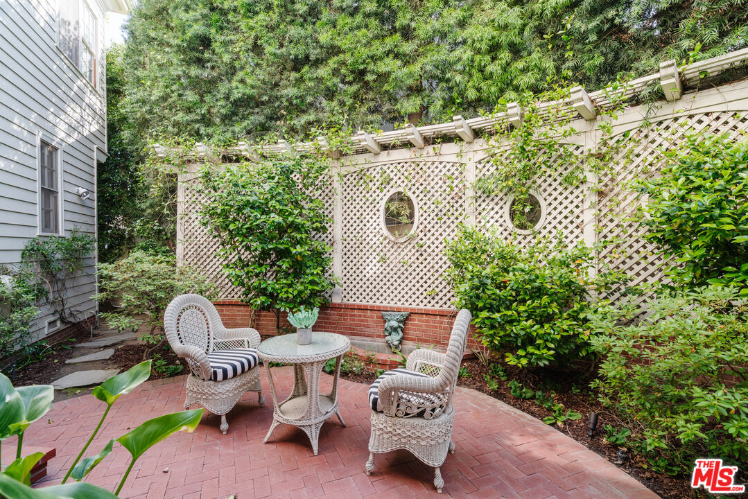 4261 Ledge Avenue Toluca Lake, CA 91602 - Photo 44 of 49 a backyard of a house with a yard and outdoor seating