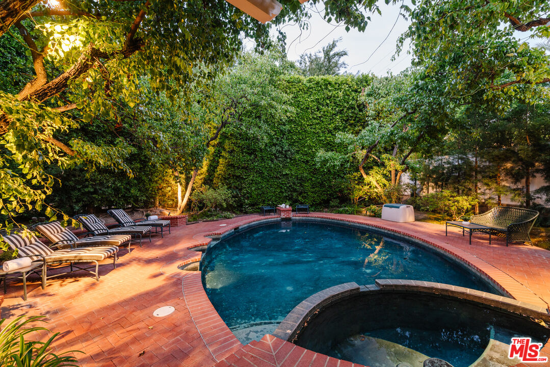 4261 Ledge Avenue Toluca Lake, CA 91602 - Photo 6 of 49 a view of a swimming pool from a outdoor space