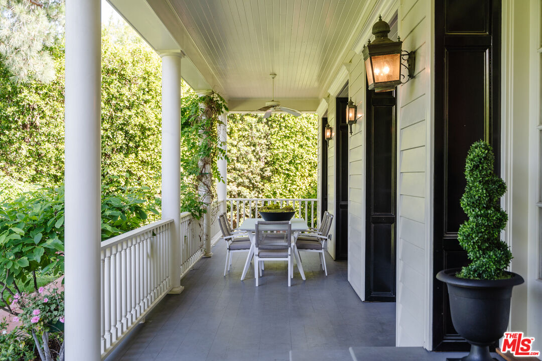 4261 Ledge Avenue Toluca Lake, CA 91602 - Photo 7 of 49 a balcony with furniture and potted plants