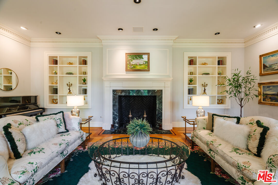 4261 Ledge Avenue Toluca Lake, CA 91602 - Photo 10 of 49 a living room with furniture and a fireplace