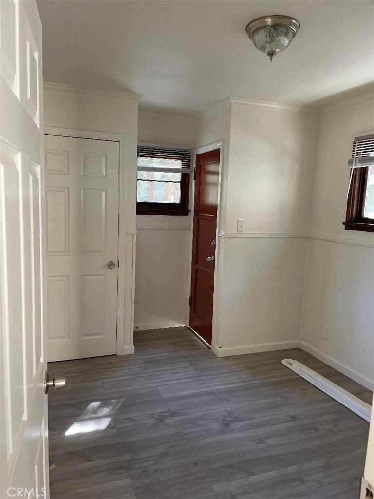 23689 Manzanita Drive, Unit 3 Crestline, CA 92325 - Photo 2 of 5 a view of a livingroom with wooden floor