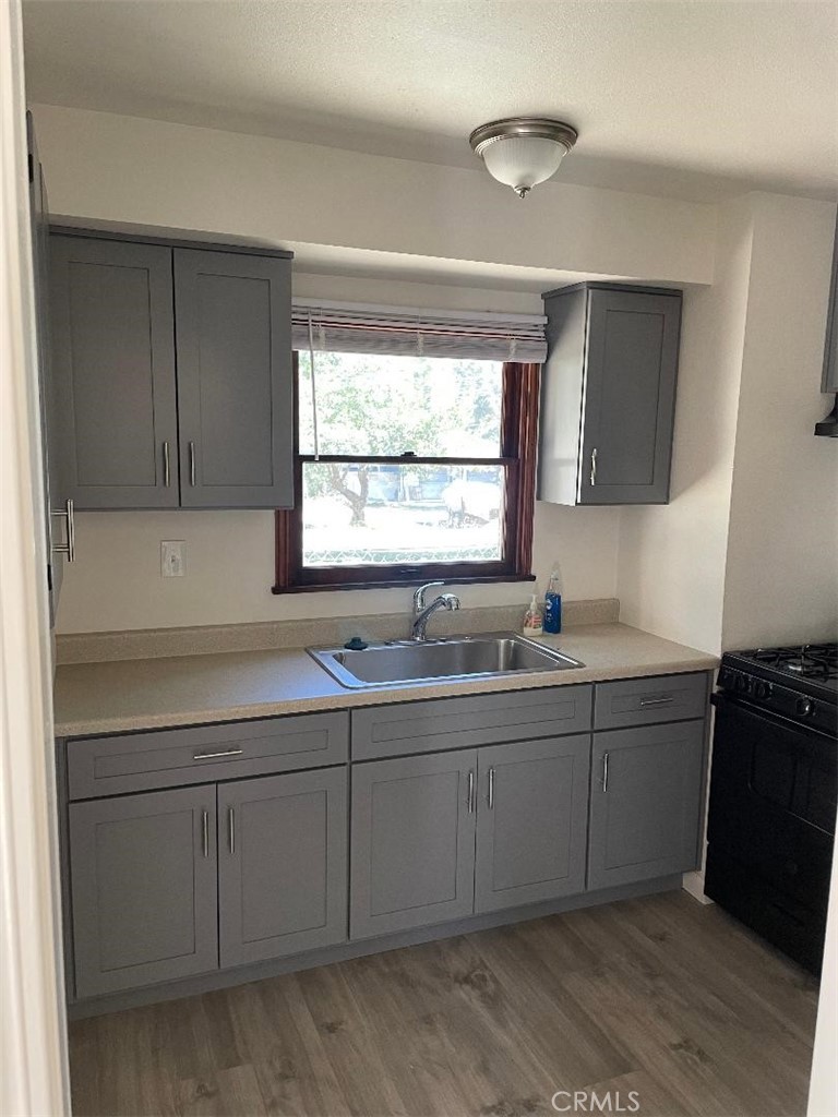 23689 Manzanita Drive, Unit 3 Crestline, CA 92325 - Photo 4 of 5 a kitchen with sink and window