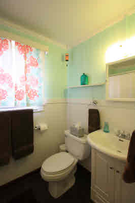 4817 Koko Road Hanapepe, HI 96716 - Photo 12 of 21 a bathroom with a toilet sink and mirror