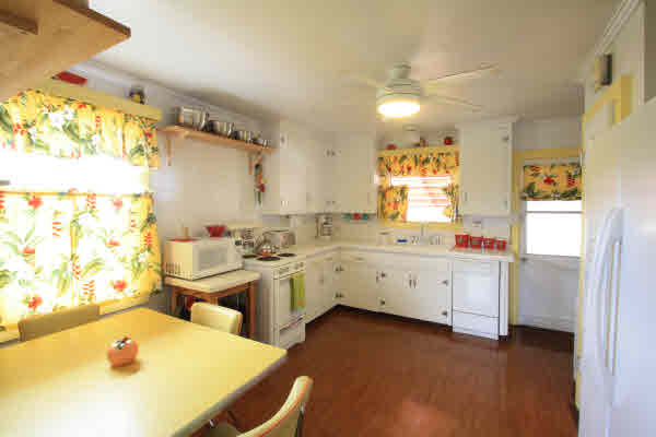 4817 Koko Road Hanapepe, HI 96716 - Photo 14 of 21 a large white kitchen with a stove a sink dishwasher and a refrigerator