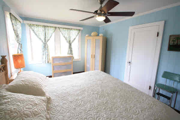 4817 Koko Road Hanapepe, HI 96716 - Photo 8 of 21 a bedroom with a bed dresser and a window