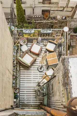a view of a balcony with table and chairs