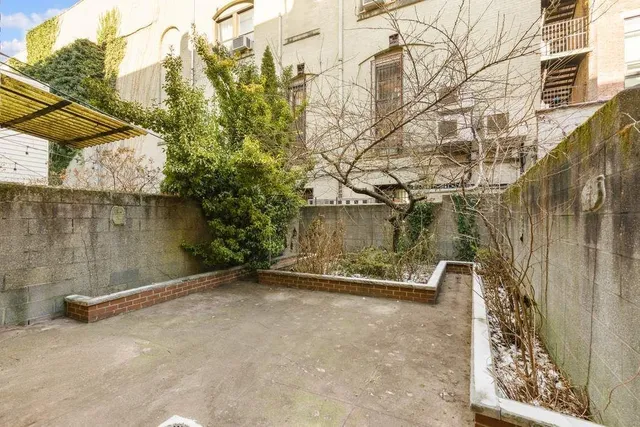 a view of a street with a building in the background