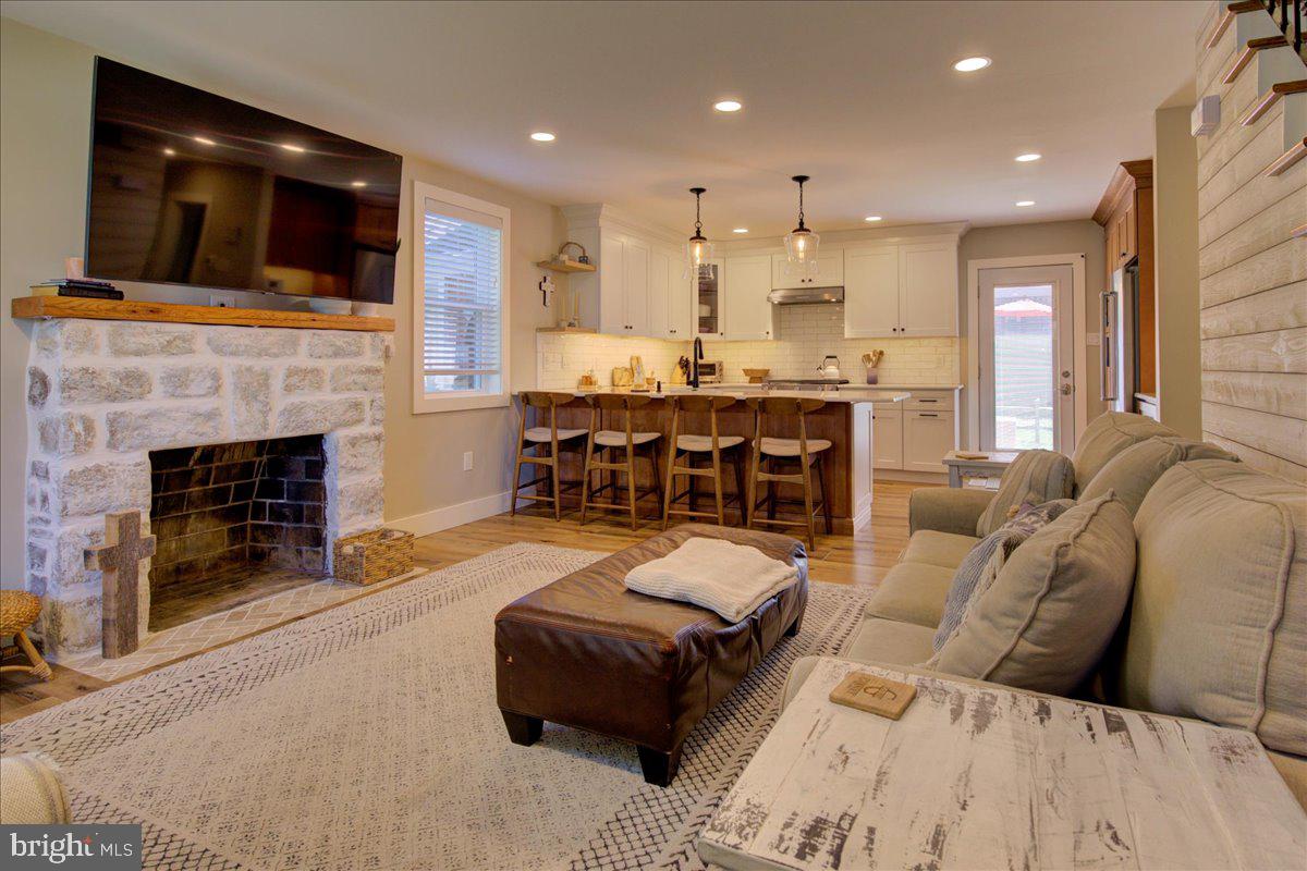 172 Scenic Road Springfield, PA 19064 - Photo 8 of 40 a living room with furniture and a fireplace