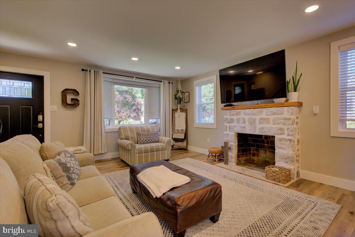 172 Scenic Road Springfield, PA 19064 - Photo 10 of 40 a living room with furniture and a fireplace