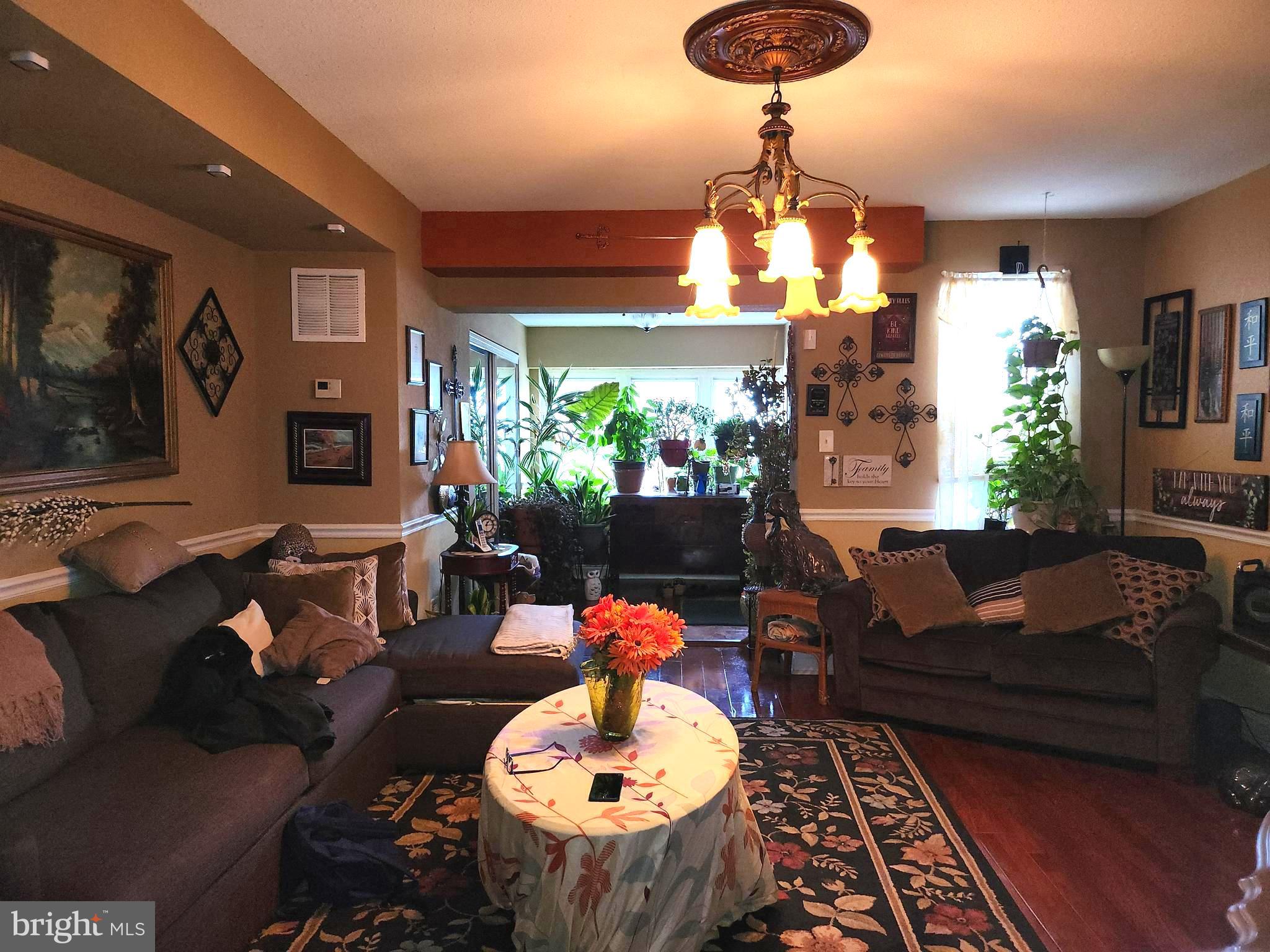 6002 North 19th Street Philadelphia, PA 19141 - Photo 11 of 25 a living room with furniture and a chandelier