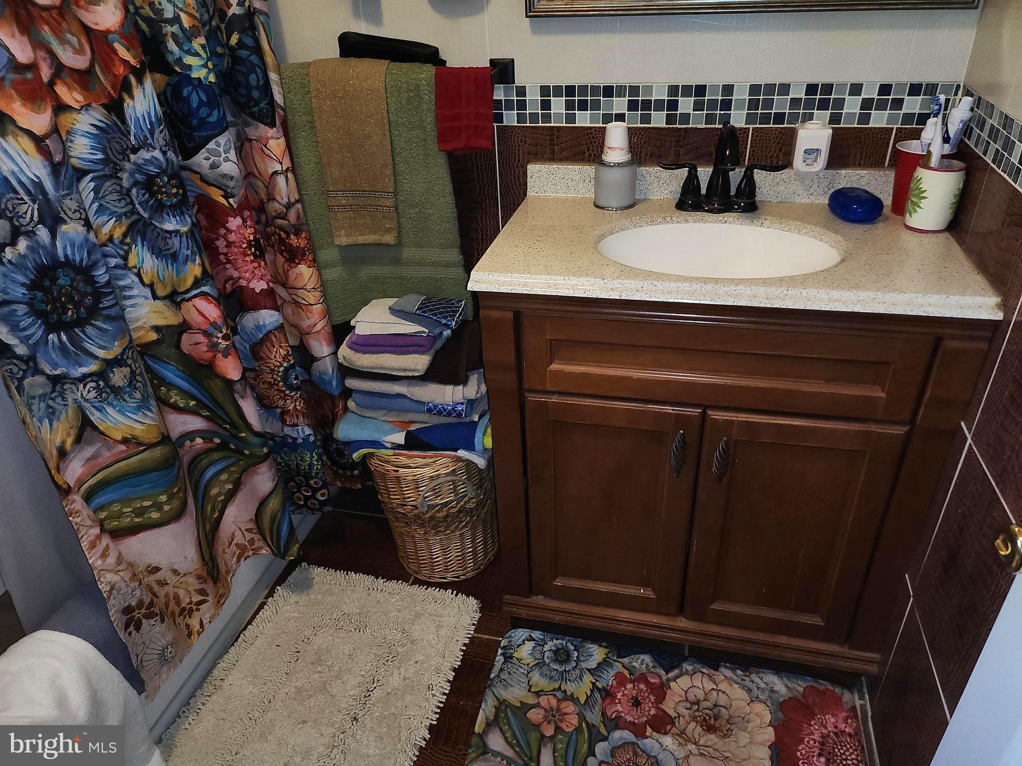 6002 North 19th Street Philadelphia, PA 19141 - Photo 15 of 25 a bathroom with a sink and a mirror