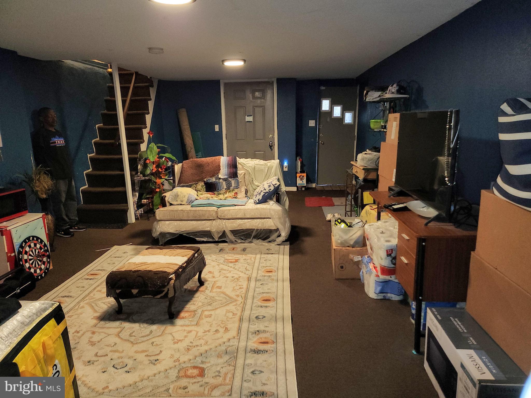 6002 North 19th Street Philadelphia, PA 19141 - Photo 22 of 25 a living room with furniture and a flat screen tv