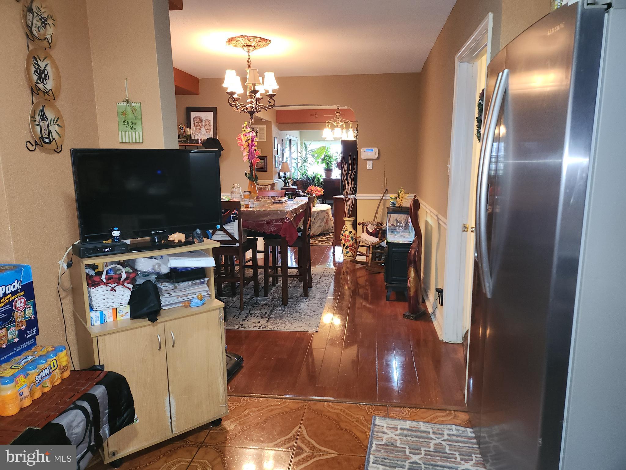 6002 North 19th Street Philadelphia, PA 19141 - Photo 6 of 25 a view of a livingroom with furniture and a flat screen tv