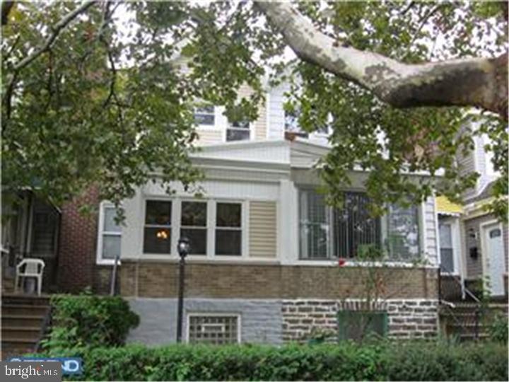 6002 North 19th Street Philadelphia, PA 19141 - Photo 8 of 25 a view of a white house with a tree