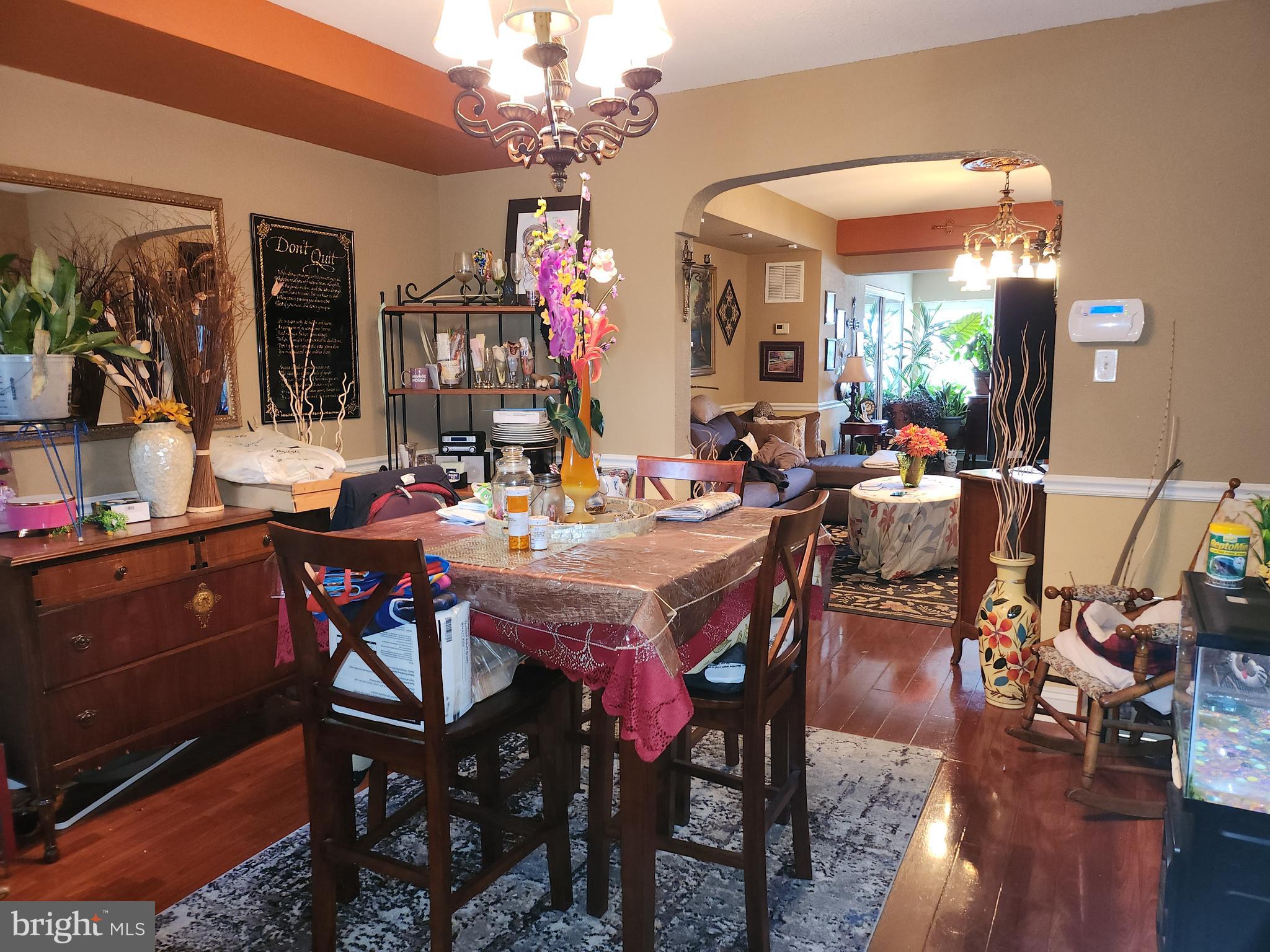 6002 North 19th Street Philadelphia, PA 19141 - Photo 9 of 25 a view of a dining room with furniture wooden floor and chandelier