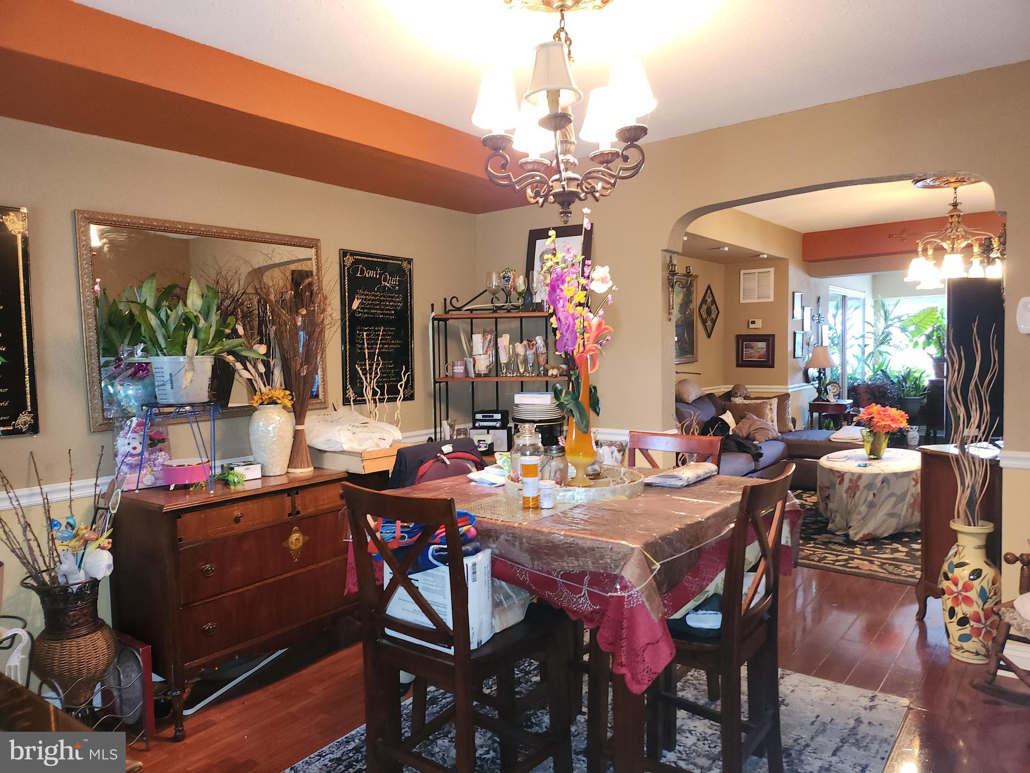 6002 North 19th Street Philadelphia, PA 19141 - Photo 10 of 25 a view of a dining room with furniture and a chandelier