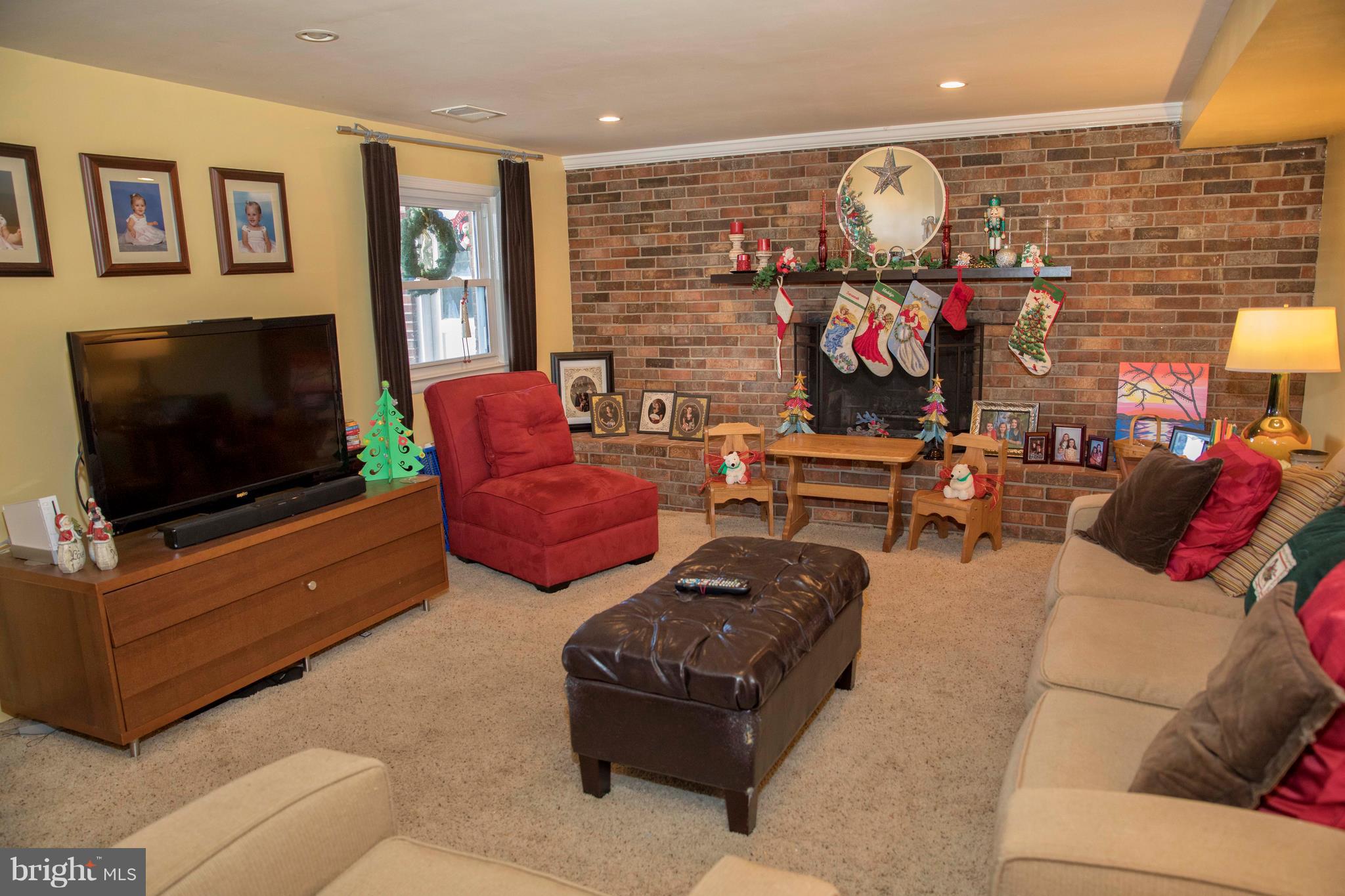 10007 Ellis Road Manassas, VA 20111 - Photo 2 of 24 Lower Level Family Room w/wood burning fireplace