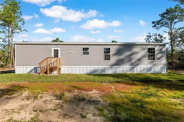 a view of a backyard of the house