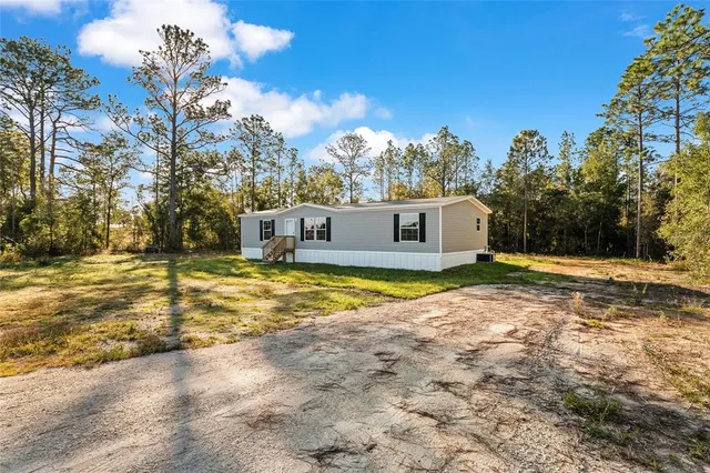 a view of a house with swimming pool