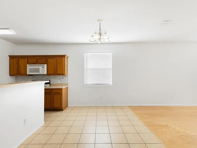 a view of an empty room with a fireplace