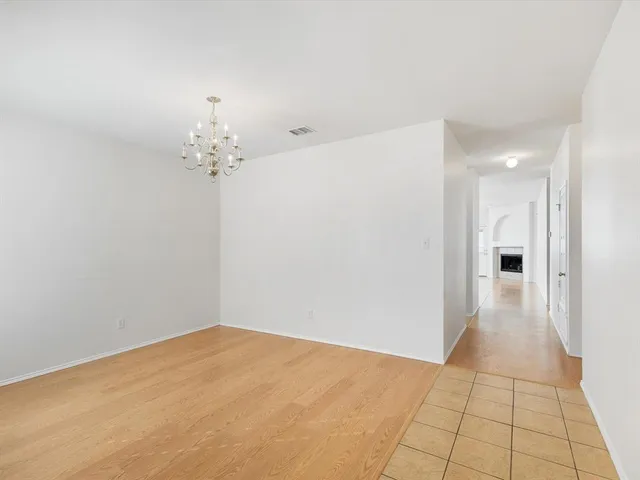 a kitchen with stainless steel appliances granite countertop a sink and a refrigerator