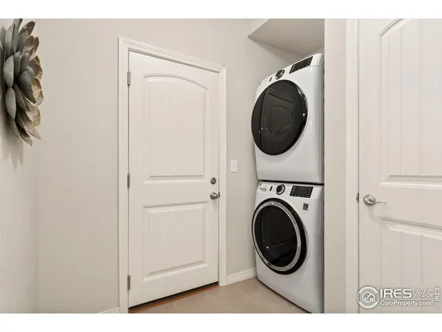 a view of a hallway with washer and dryer