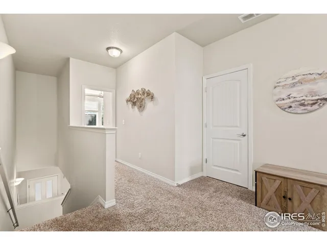 a room with furniture and mirror