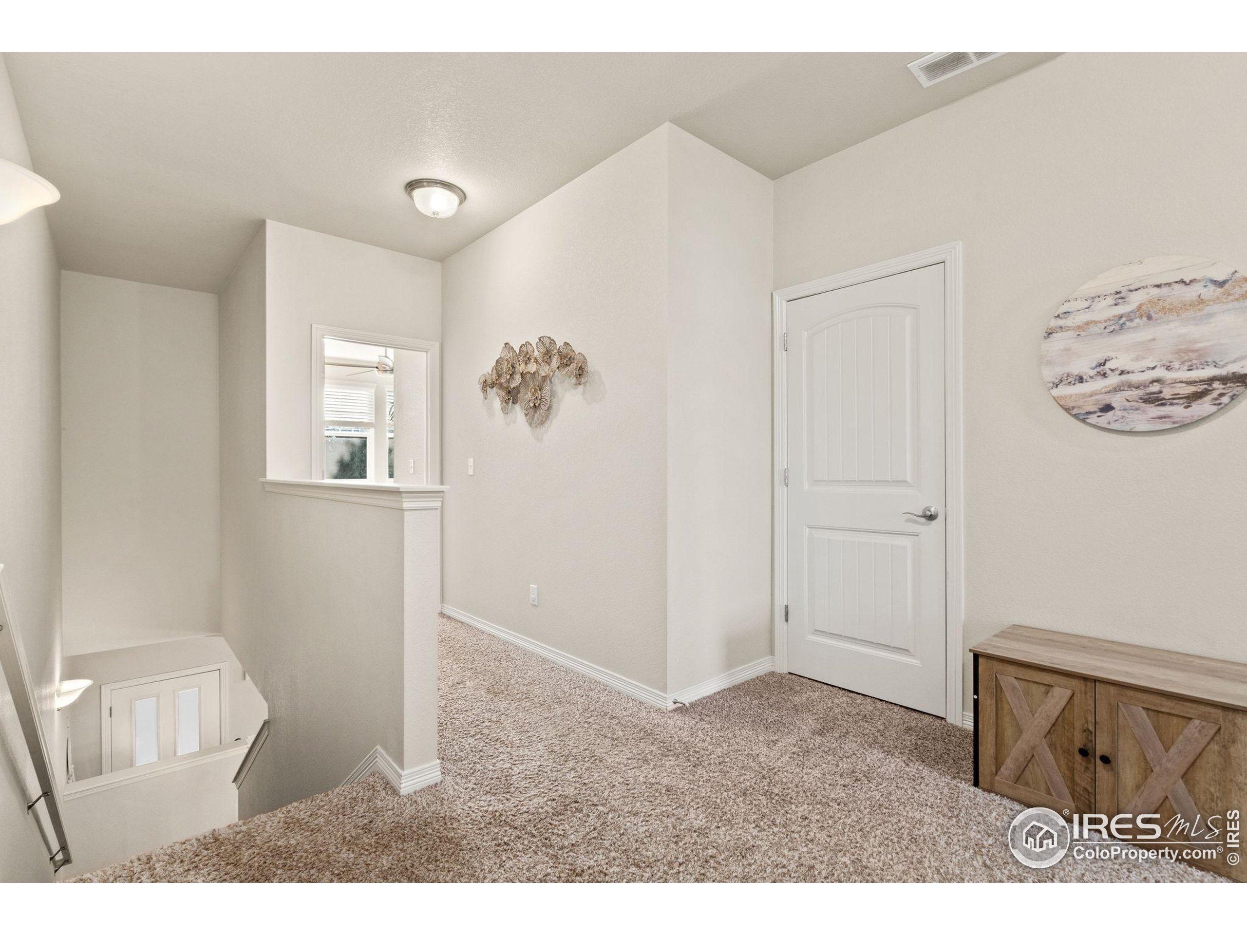 865 Winding Brook Drive Berthoud, CO 80513 - Photo 13 of 27 a room with furniture and mirror