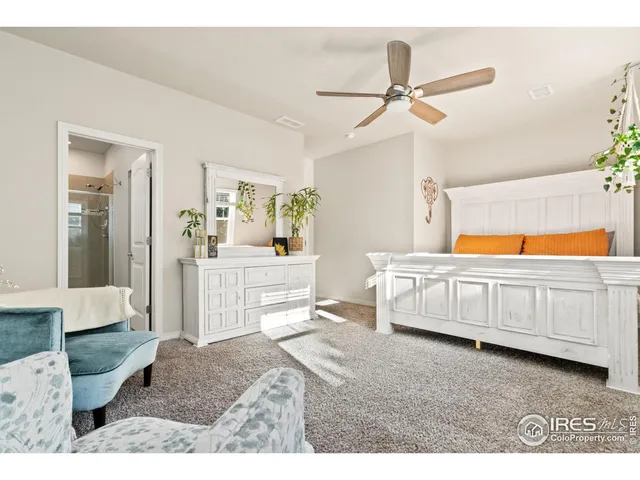 a bedroom with furniture and window