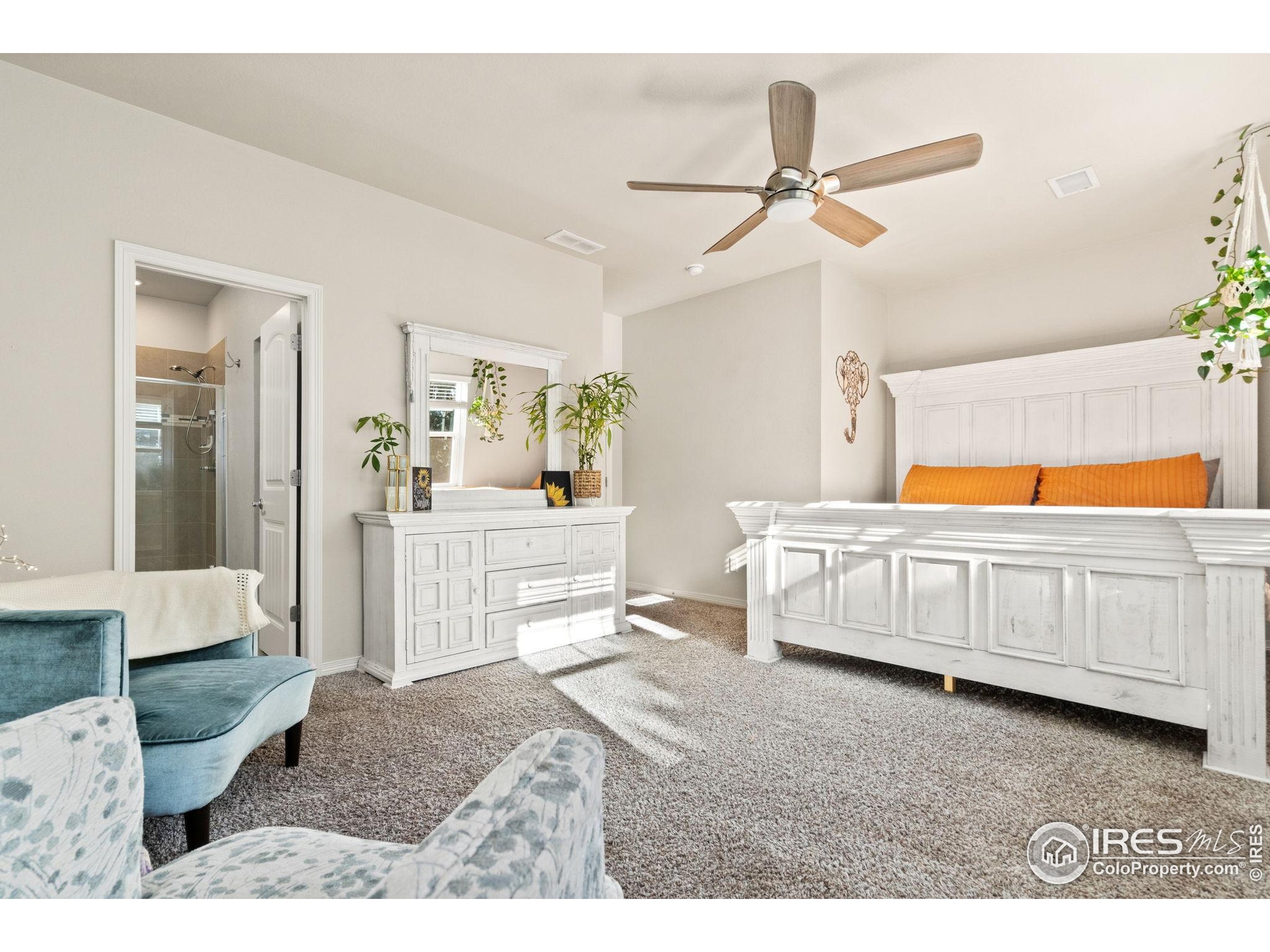 865 Winding Brook Drive Berthoud, CO 80513 - Photo 15 of 27 a bedroom with furniture and window