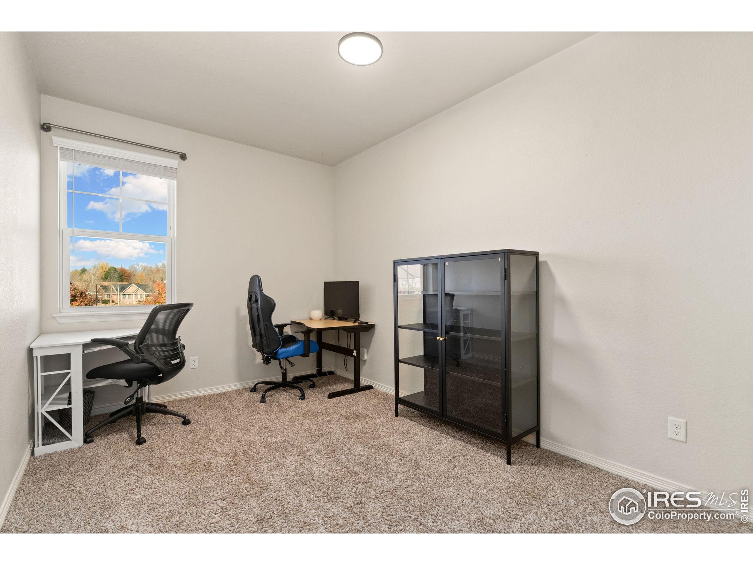 865 Winding Brook Drive Berthoud, CO 80513 - Photo 18 of 27 a living room with furniture